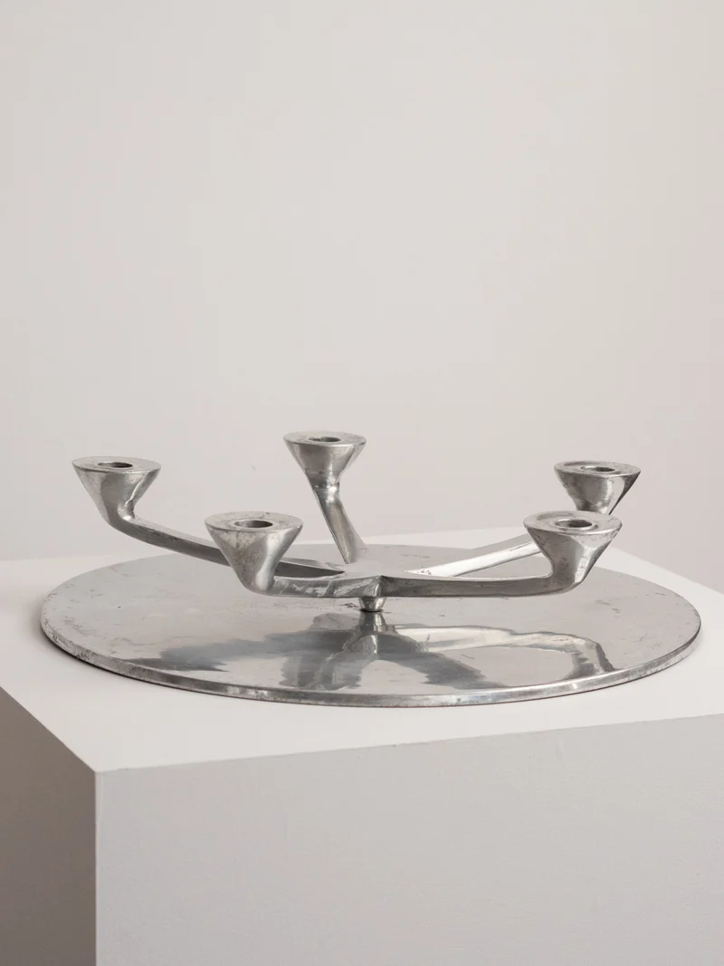 Rotating Five Arm Star Candleholder in Sand Cast Aluminium