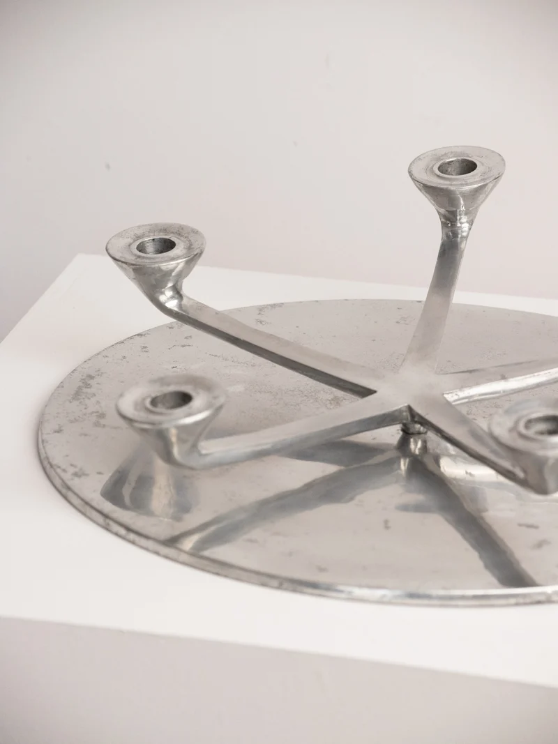 Rotating Five Arm Star Candleholder in Sand Cast Aluminium