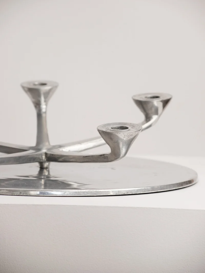 Rotating Five Arm Star Candleholder in Sand Cast Aluminium