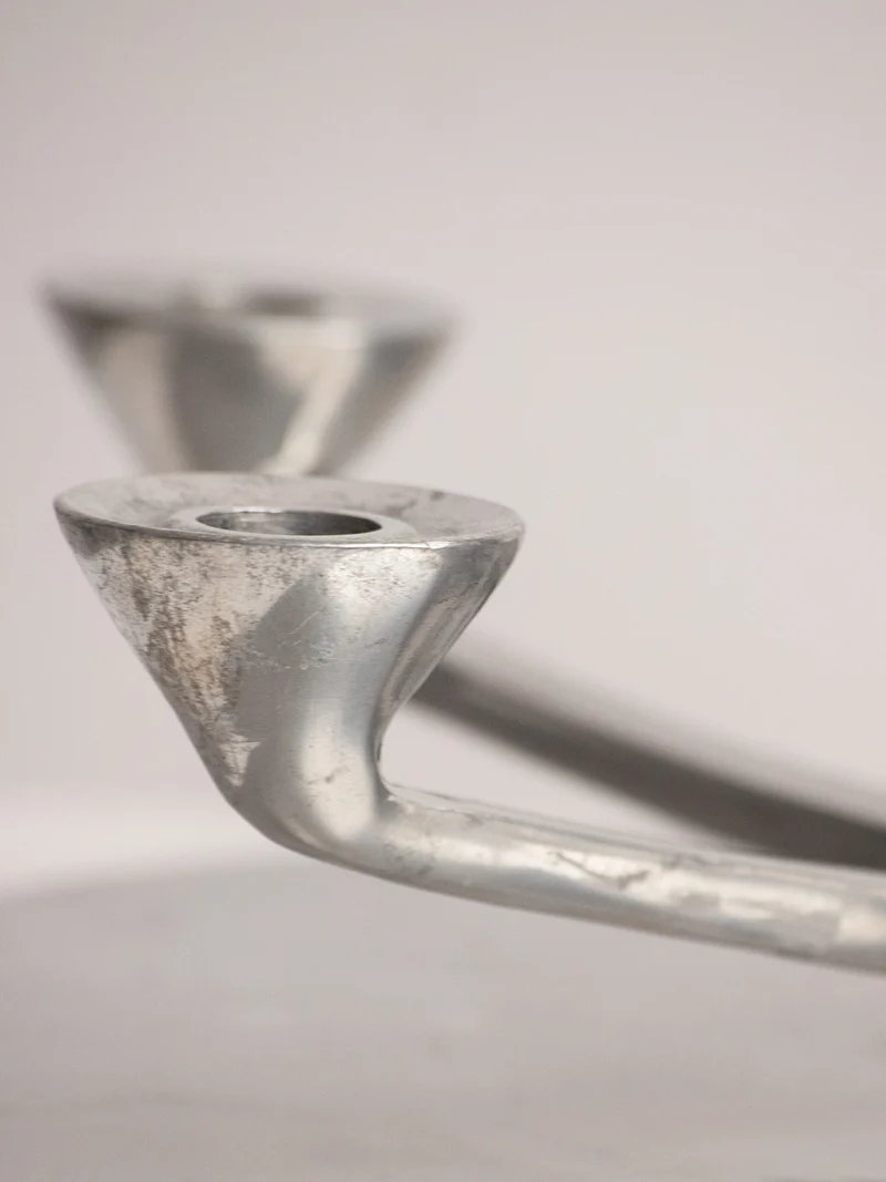 Rotating Five Arm Star Candleholder in Sand Cast Aluminium
