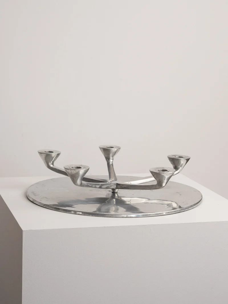 Rotating Five Arm Star Candleholder in Sand Cast Aluminium