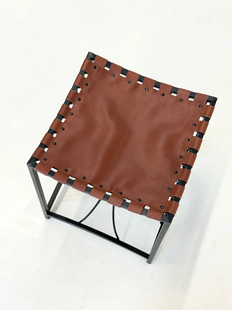 Elegant vintage French stool with black metal and brown leather