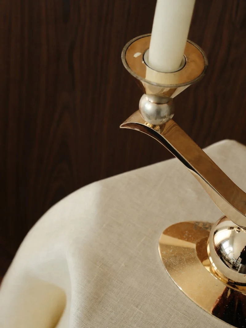 A Sculptural Silver- and Gold-Patinated Metal Candle Holder