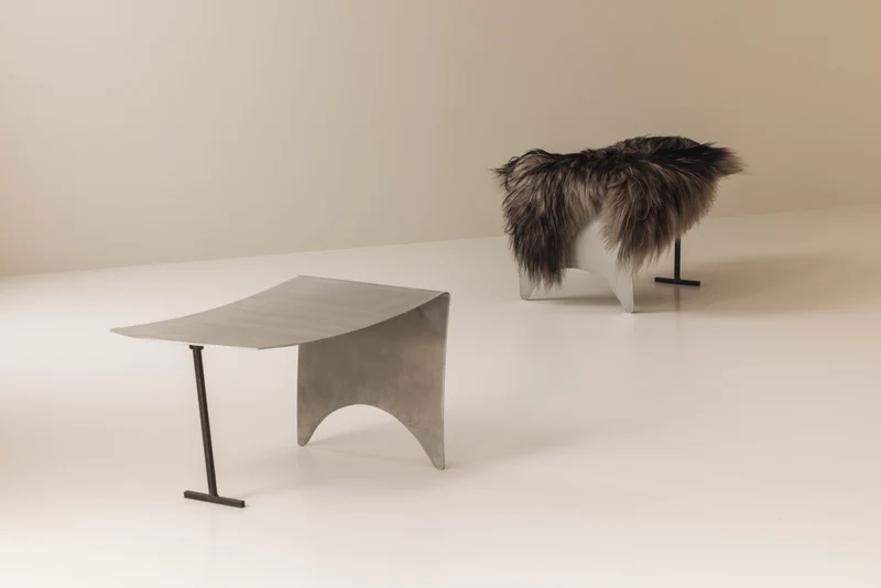 A striking set Modernist curved metal stools from France, dating to the 1980s.