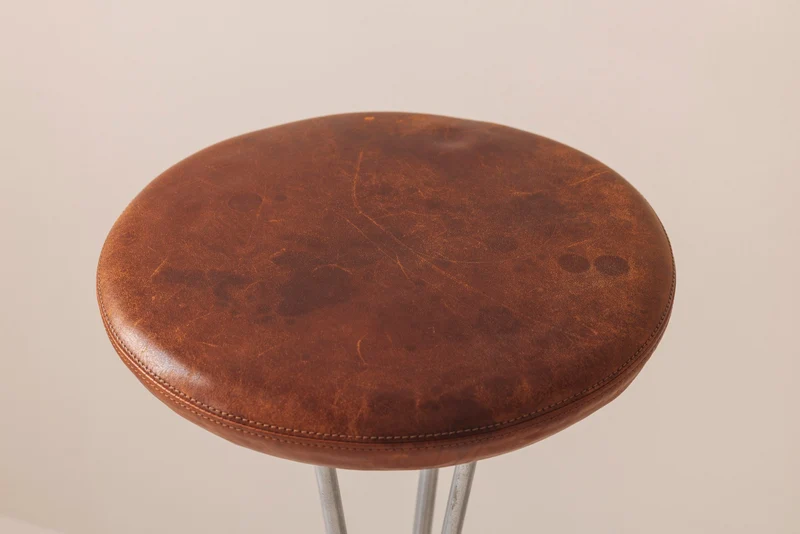 Set of Two Bar Stools in patinated leather by Piet Hein for Fritz Hansen, Denmark, 1960s