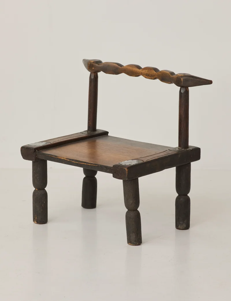 Small artisanal vintage West African chair "Baoulé" in solid wood C. 1960