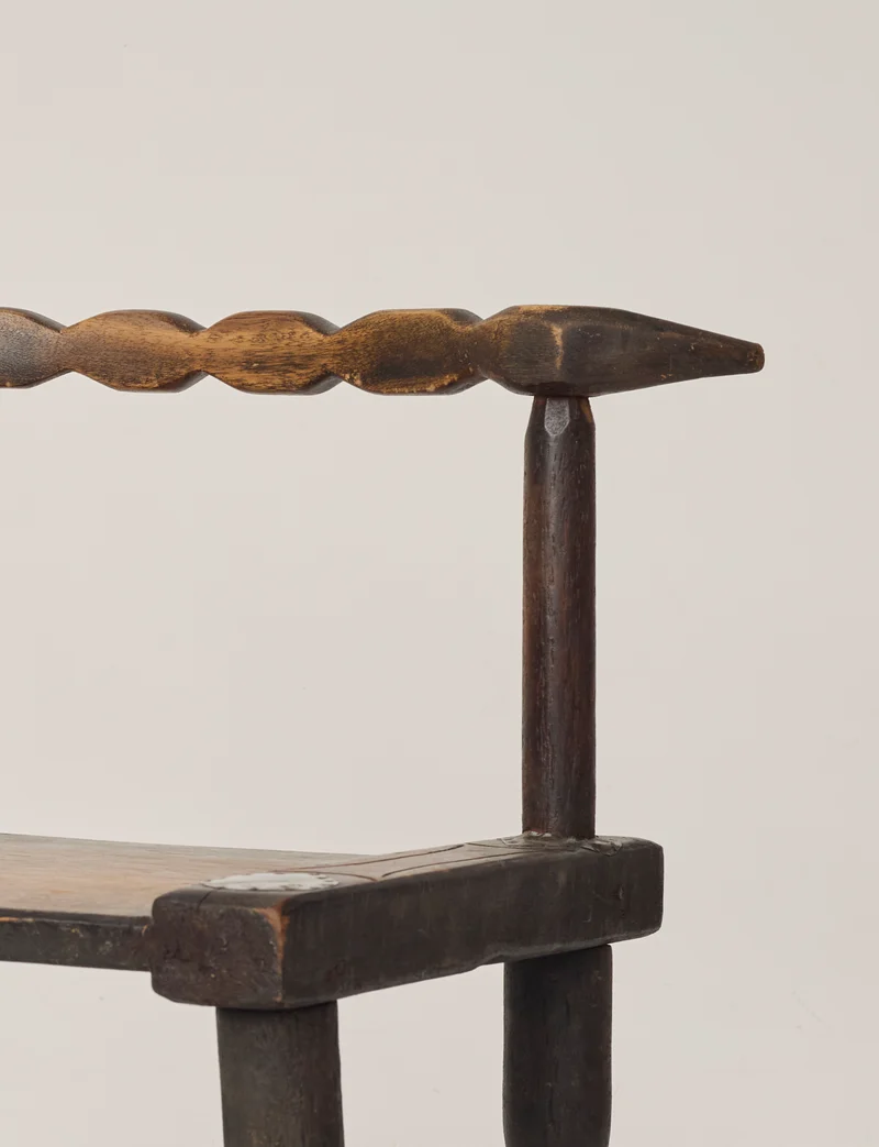 Small artisanal vintage West African chair "Baoulé" in solid wood C. 1960