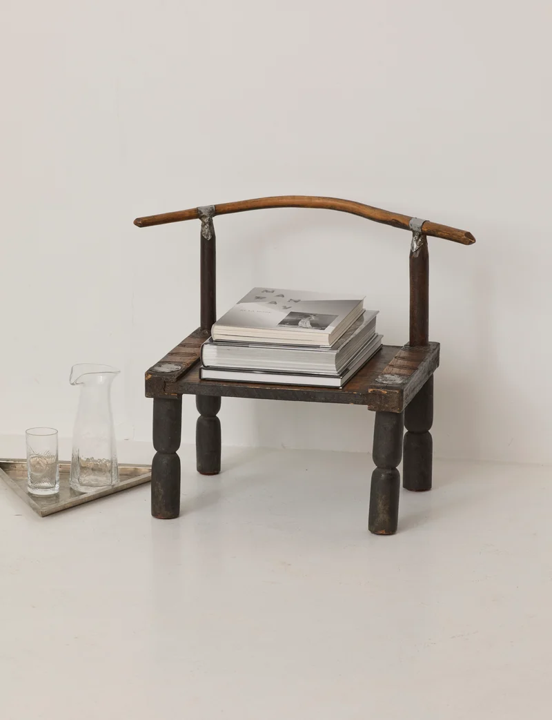 Small artisanal vintage West African chair "Baoulé" in solid wood C. 1960