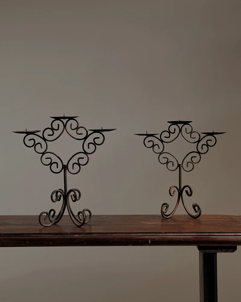 Pair of three-light wrought-iron candleholders, circa 1950