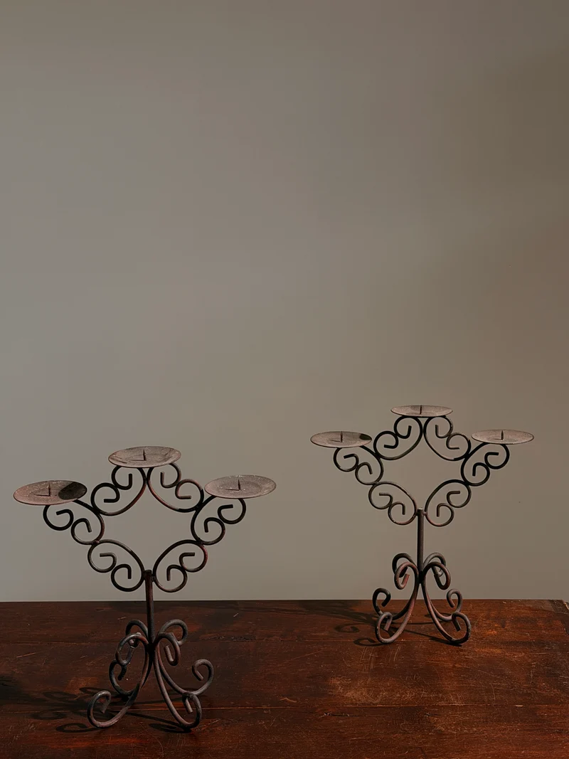 Pair of three-light wrought-iron candleholders, circa 1950