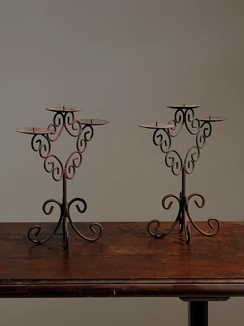 Pair of three-light wrought-iron candleholders, circa 1950