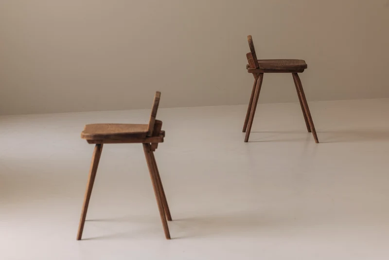 Sculptural pair of French solid oak side chairs from the 1950s