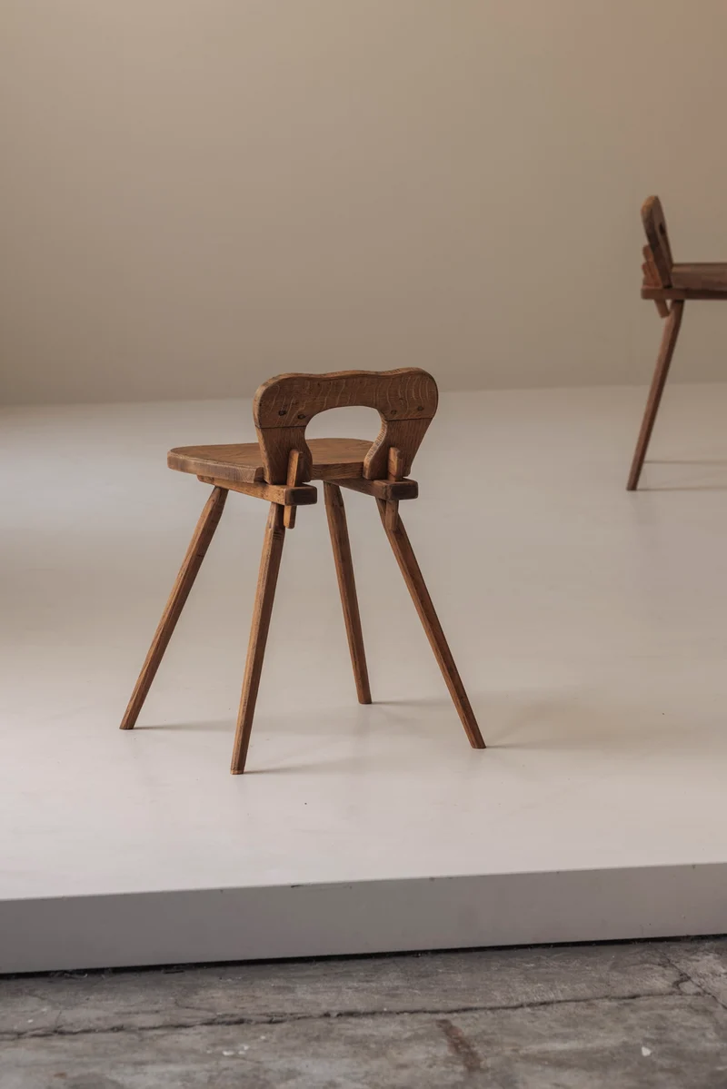 Sculptural pair of French solid oak side chairs from the 1950s