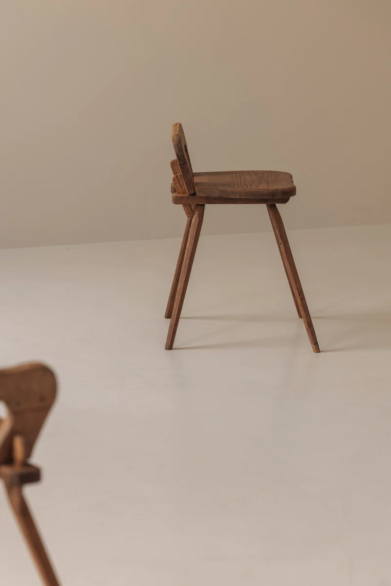Sculptural pair of French solid oak side chairs from the 1950s
