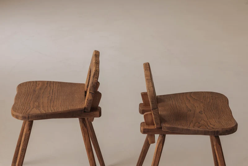 Sculptural pair of French solid oak side chairs from the 1950s