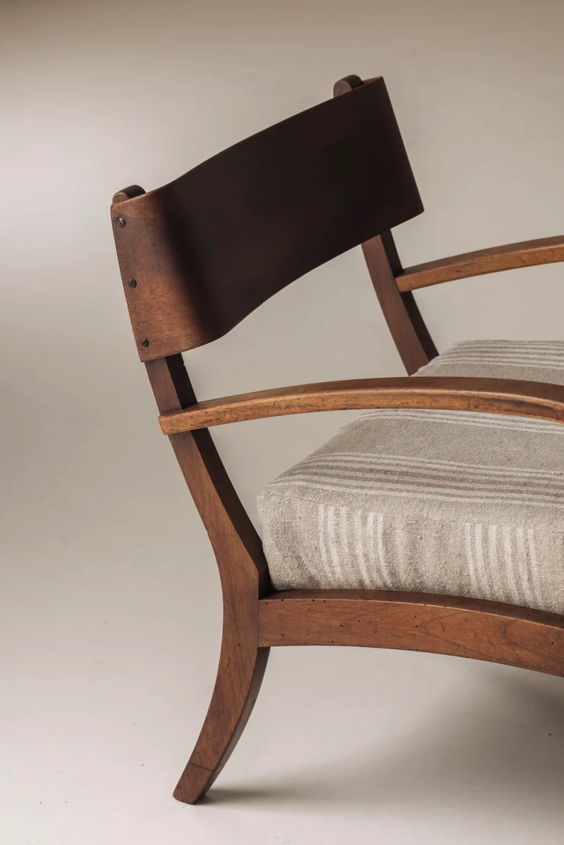 Sculptural pair of Italian easy chairs in walnut from the 1950s.