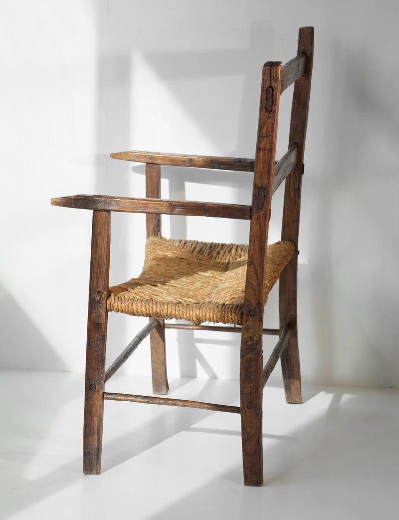 A French folk bench from the 19th Century. Wood and straw