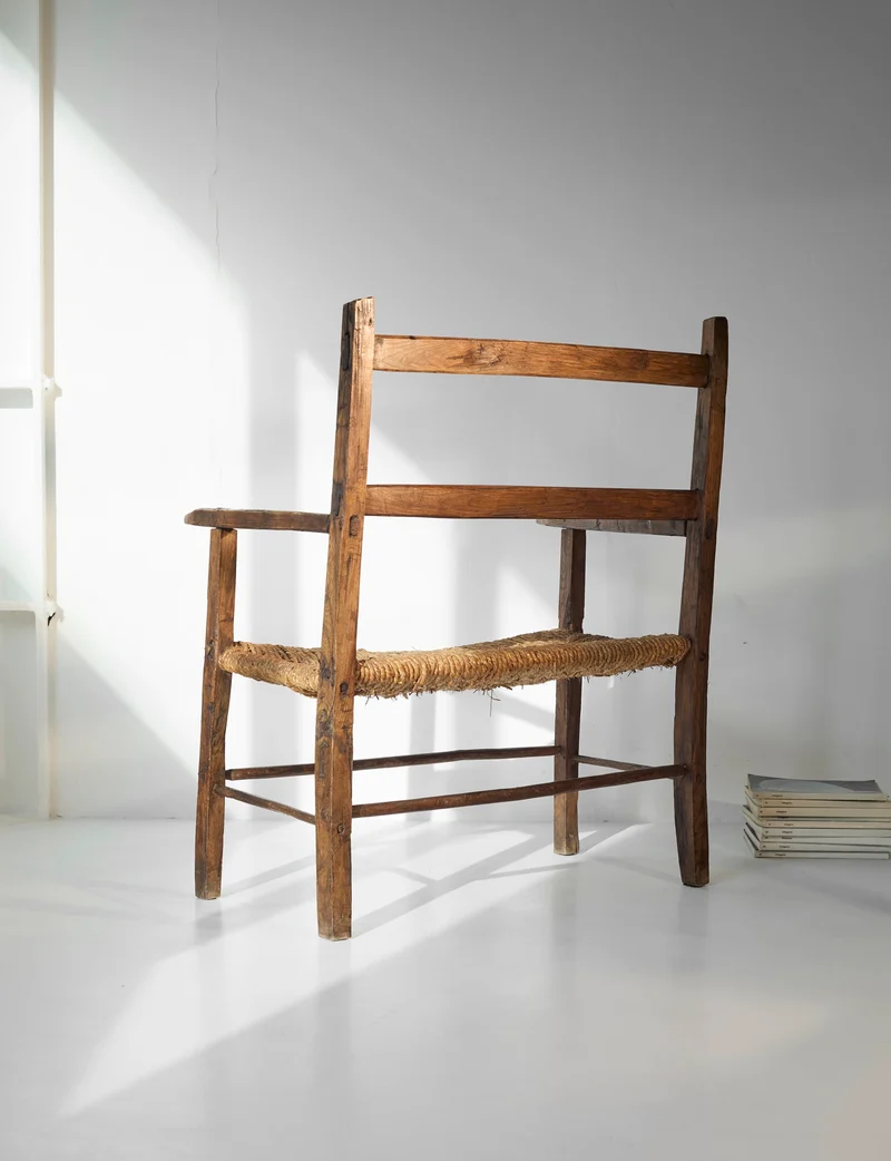 A French folk bench from the 19th Century. Wood and straw