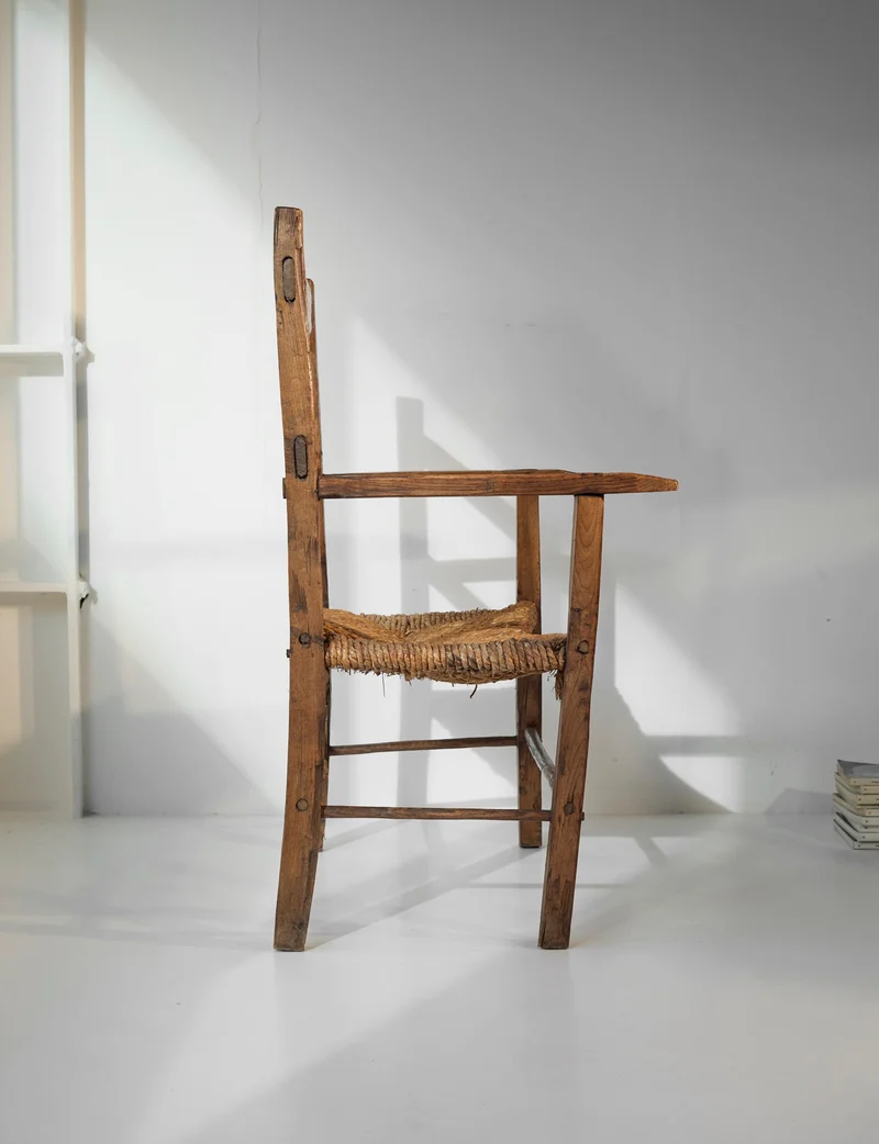A French folk bench from the 19th Century. Wood and straw