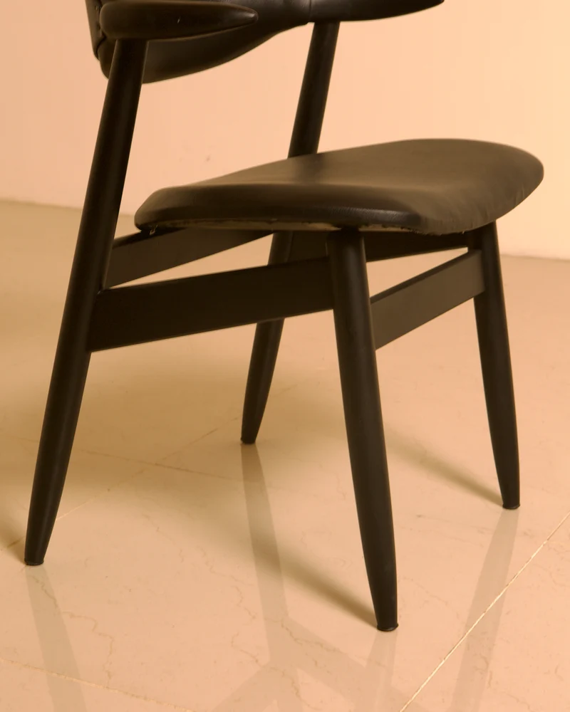 Dutch "Buffalo" armchair in wood and black leather, 1960s