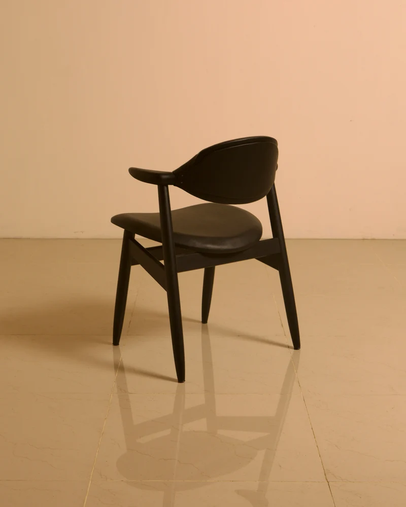 Dutch "Buffalo" armchair in wood and black leather, 1960s