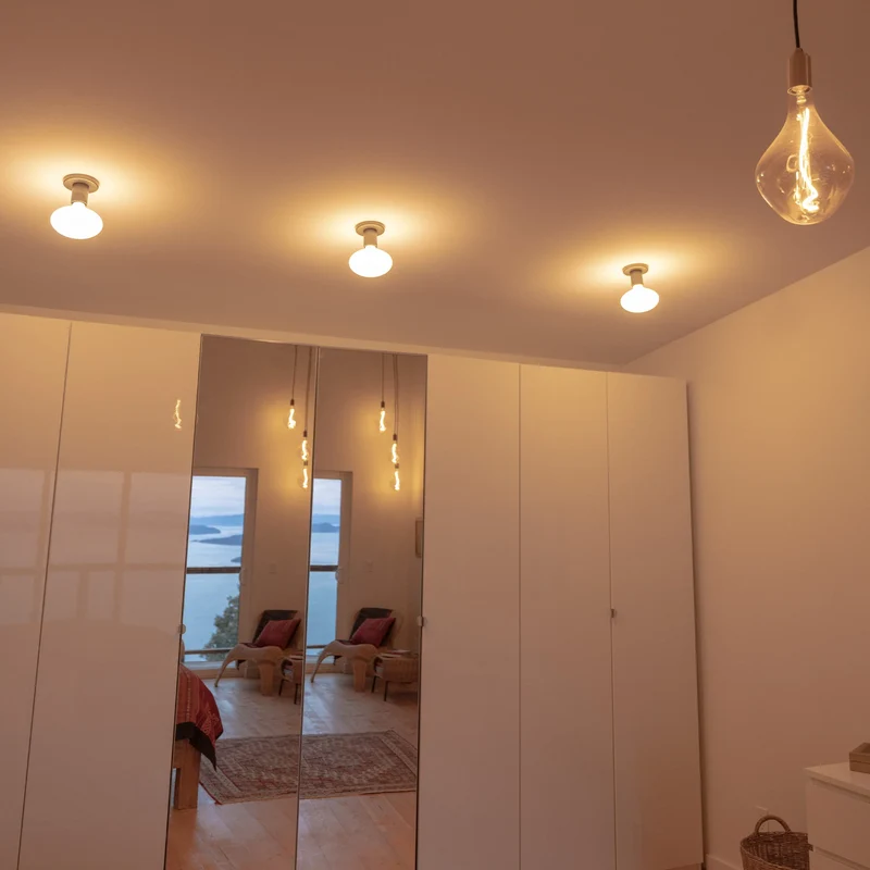 Lochan Wall Light in Brass + Oval Dim to Warm