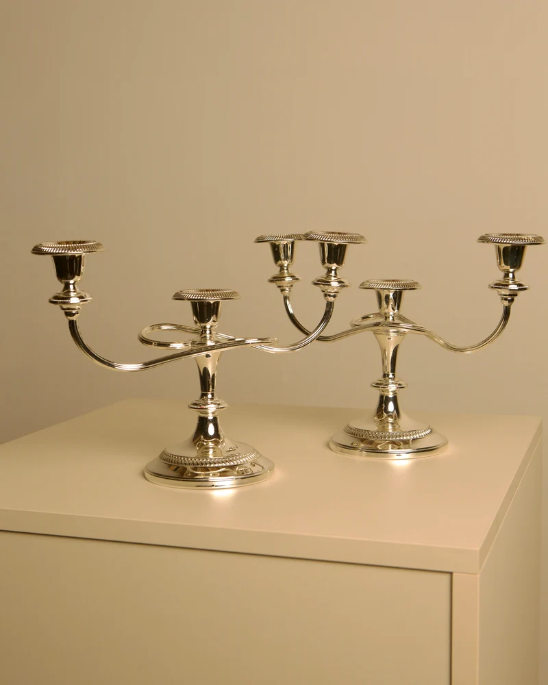 Pair of Italian metal "Medusa" candlesticks, 1980s