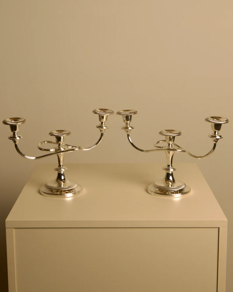 Pair of Italian metal "Medusa" candlesticks, 1980s