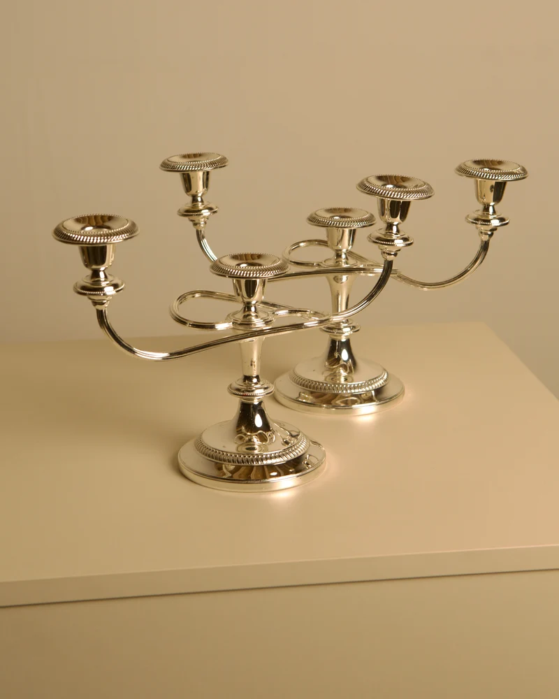Pair of Italian metal "Medusa" candlesticks, 1980s