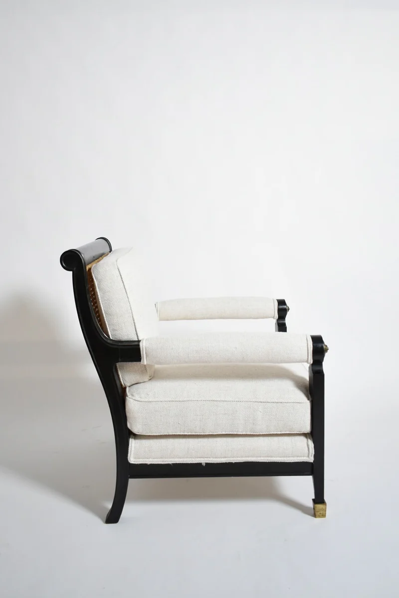 Pair of neoclassical ebonised wood and caning armchairs, 1960s