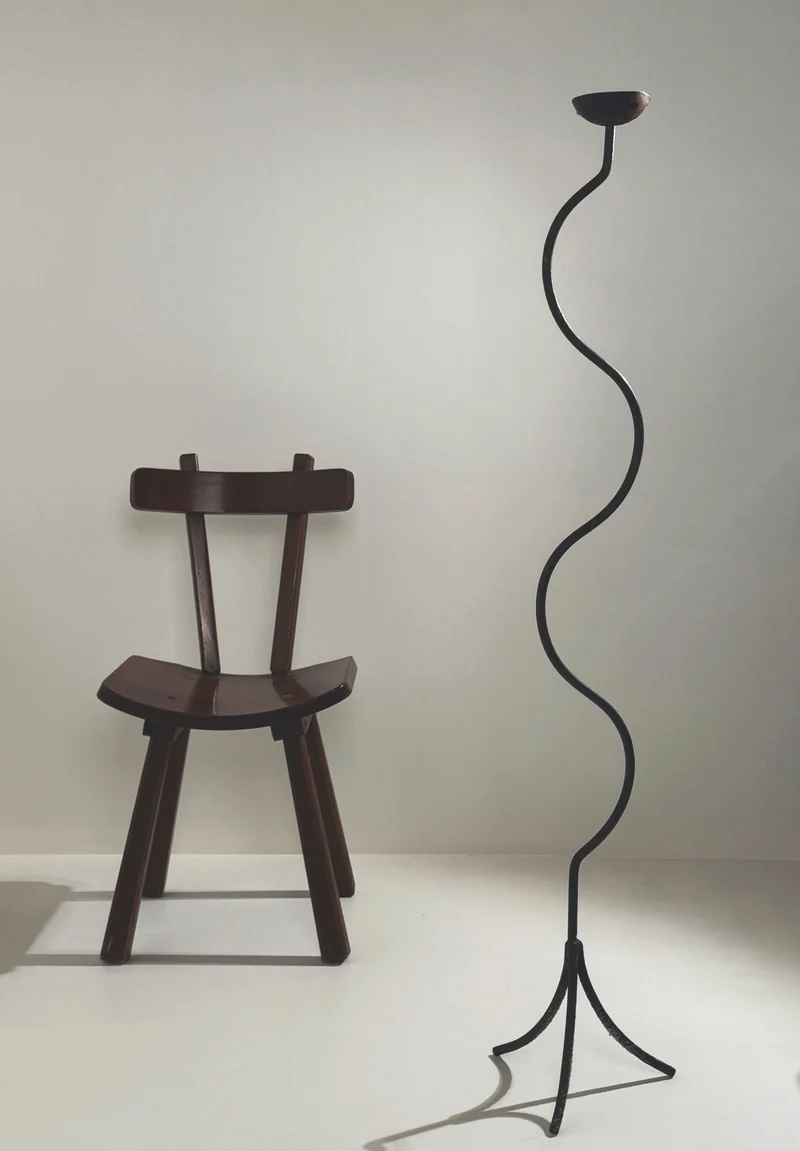 Large sculptural wrought iron candleholder.