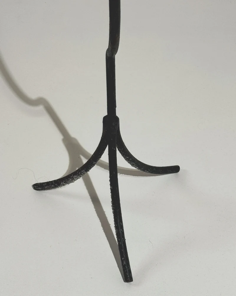 Large sculptural wrought iron candleholder.